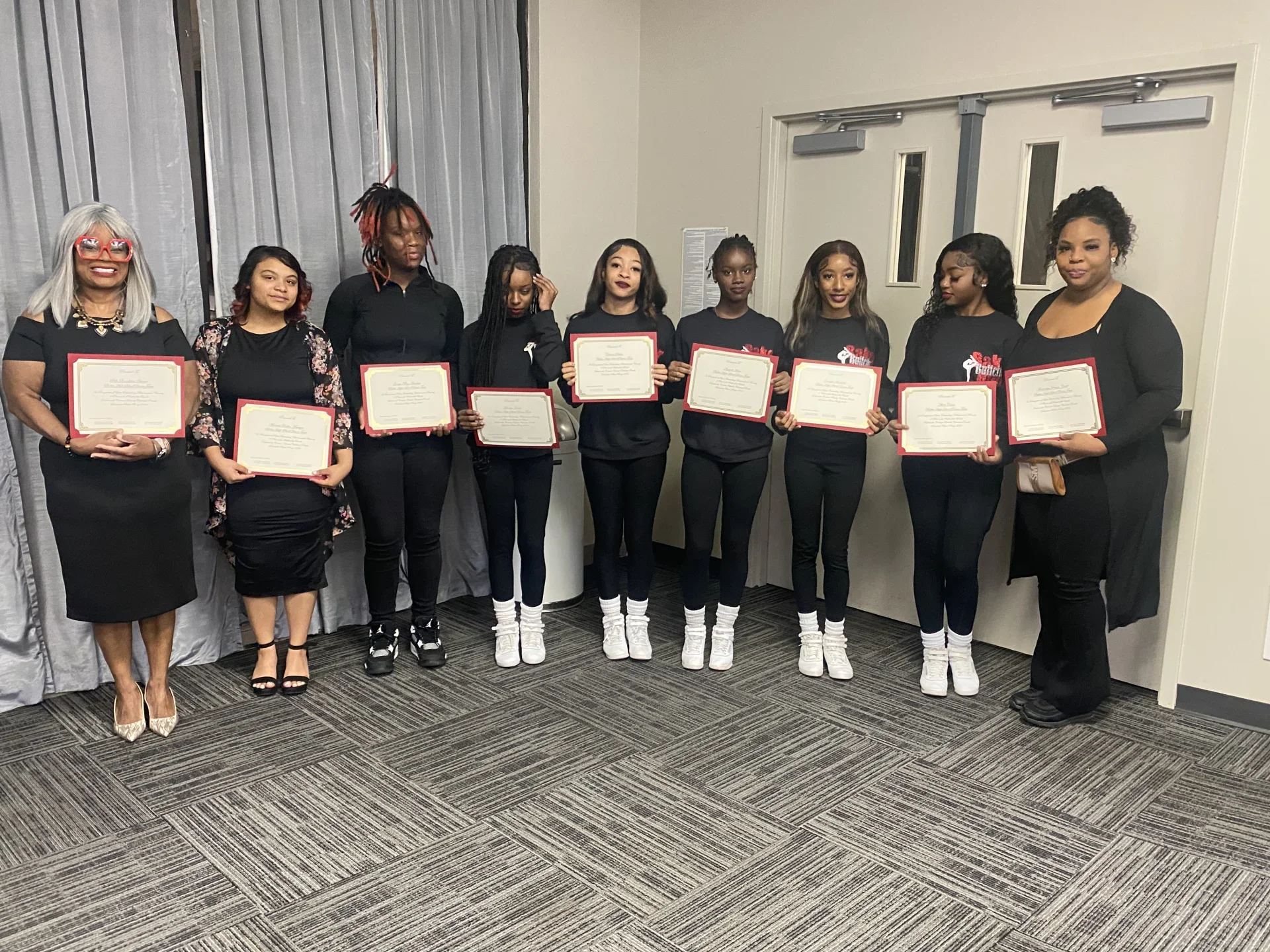 BHS dance team posing with award certificates