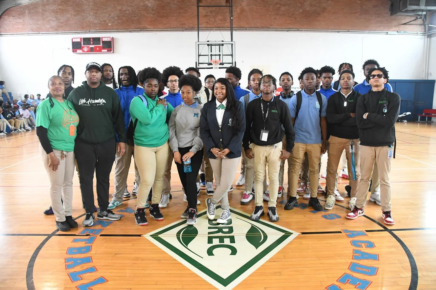 some students and faculty on a basketball court