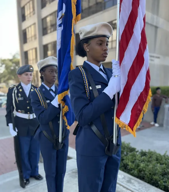 3 members of a color guard detail